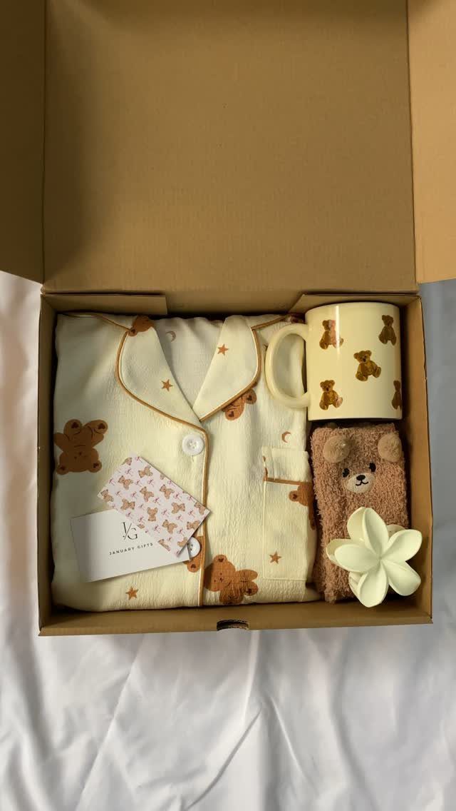 Cream pajama set with brown bear prints in a gift box with mug.