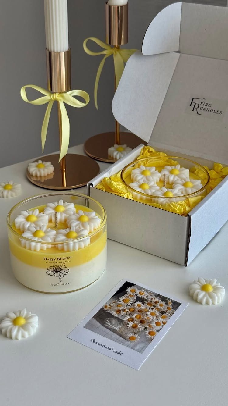 Yellow daisy-themed candle gift set with wax melts and gold candle holders.